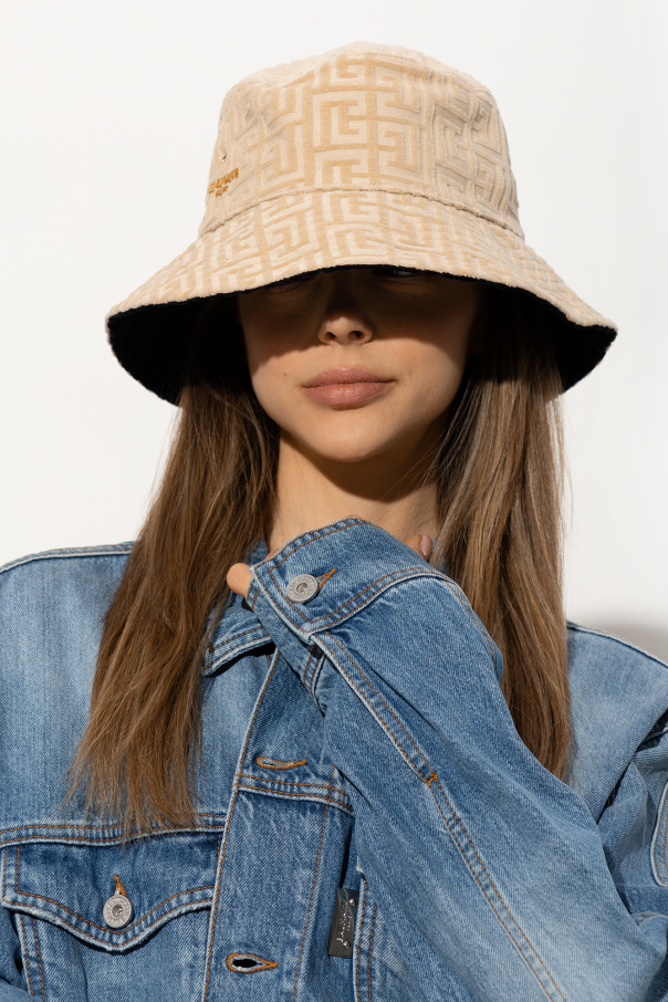 calvin Reversible bucket hat Balmain dark denim jeans and a baker boy hat from the brand s new range Biname fmedShops Japan